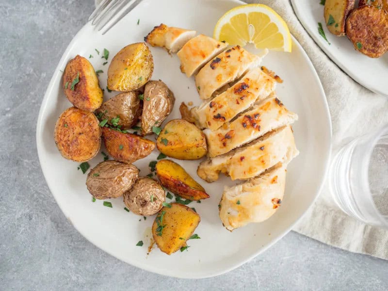 image 5486 - Taking it back to the basics never tasted so delicious! Garlic Chicken & Roasted Potatoes never overdoes it, but it's the farthest thing away from boring too. The next time you don't know what to make for dinner, pull out all your pantry staples to create this perfectly juicy, tender, and savory chicken plated next to some herby, filling, hearty red potatoes. And once you taste it, we're pretty confident Garlic Chicken & Roasted Potatoes will show up on your table numerous times throughout the month. It's just that good!