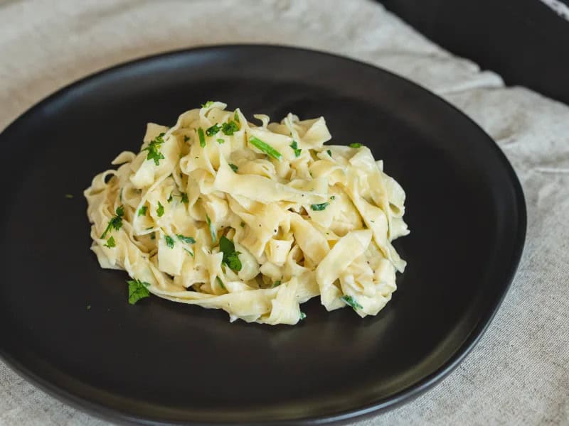 image 5732 - Low-Cal Fettuccine Alfredo is a guilt-free version of your favorite classic, creamy Italian dish! Can you believe it?! It's made with the tender fettuccine noodles we all love so much, coated in a creamy and velvety sauce that's lightened up a little, but still delivers all the satisfying flavors. It's got it all, plus, you don't have to feel bad about it later! Low-Cal Fettuccine Alfredo is the best way to enjoy yourself without compromising your health goals!