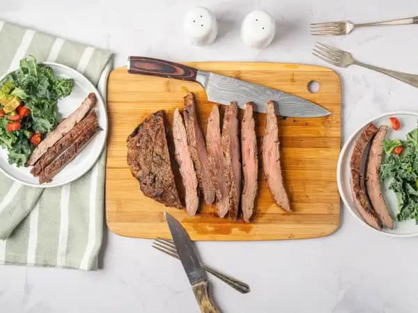 image 5752 - Of all the cuts of steak, the humble flank steak is one of the most receptive to marinades. It soaks up all the flavors like a sponge, so the question becomes what flavors you want to impart to your dinner. This Balsamic Marinated Flank Steak is one of the most delicious ways to take advantage of that opportunity, infusing the tanginess and smoky flavor of the balsamic into the savory steak. Soy sauce and mustard in the marinade helps enhance the umami of the beef flavor, while chili flakes ensure a light heat that keeps every bite exciting. Balsamic Marinated Flank Steak is the best way to guarantee your steak dinner is the most amazing you could ever imagine!