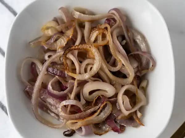 image 5995 - Why would anyone opt for raw red onions when these Roasted Red Onions are quick, easy, and right there? Instead of the sharp spiciness you might expect, Roasted Red Onions are caramelized, sweet, and tender, just ready to be piled onto burgers or thrown on top of some steaks, or maybe just enjoyed on their own next to your favorite protein! It's all good with Roasted Red Onions; it's the best way to enjoy onion flavor without all the harshness!