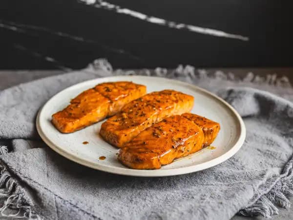 image 6271 - If you want your partner's heart to melt this Valentine's Day, there are few better gestures than this Hearts A-Glazed Salmon! These succulent, tender, flaky fillets of salmon are glazed in smooth, smoky bourbon, sweet maple syrup, and savory soy sauce, captivating your taste buds, just as your partners captivates you heart and soul! This is a 5-star experience that's ready in 15 minutes, and without breaking a sweat! Hearts A-Glazed Salmon will have your hearts aglow with happiness!