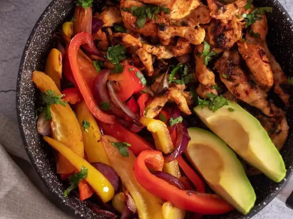 image 7007 - South-of-the-Border Fajitas are a true favorite; it's one of those classic Tex-Mex dishes that's popular just about everywhere, and for good reason! The chicken is marinated in bright, tangy fruit flavors with just the right amount of heat, and the peppers and onions are seared to be very tender and packed with flavor. These South-of-the-Border Fajitas will become a favorite in your home, as well!