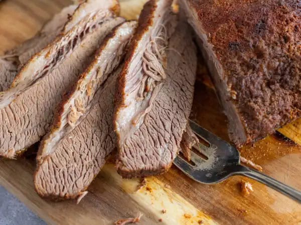 image 7040 - Some barbeque favorites are staples of cookouts, like burgers and grilled chicken. And then there are the special barbeque items, the ones that turn heads and get everyone to the picnic table. That would be the case with this Texas Roasted Beef Brisket: an extra-tender, fragrantly seasoned hunk of beef, with true succulent flavor and melt-in-your-mouth texture. You can throw some Texas Roasted Beef Brisket on a bun, over mashed potatoes, or whatever your cookout calls for! This is so delicious you might even have a few cook-ins so you can have more of it outside of grilling season!