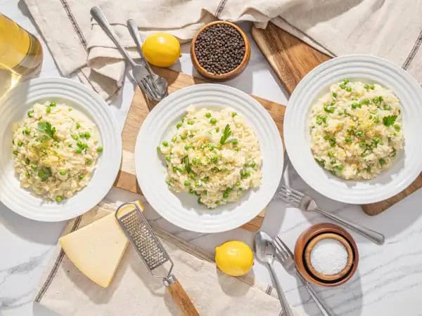 image 7390 - Valentine's Day is right around the corner, and you need to practice your romantic dinner making to really impress your partner! Here's a good suggestion; Romance-Me Risotto! Creamy, flavorful, rich, and loaded with so much goodness! Bright lemon and nutty, sharp parmesan with bursts of garden-fresh peas mingle with the poultry flavor of the broth soaked into the tender rice! Nothing says "Happy Valentine's Day" like Romance-Me Risotto!