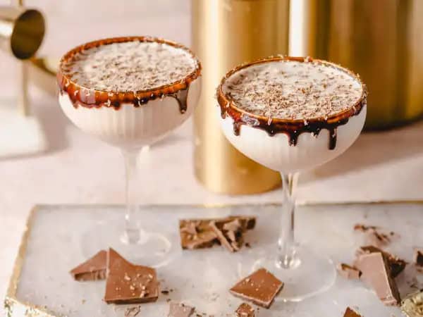 image 7579 - When the fancy neighbor asks you over for drinks, you absolutely must go! His specialty? This Chocolate Martini! And it will completely blow your chocolate-loving mind! He effortlessly fills his cocktail shaker with a shot of vivacious vanilla vodka, a generous splash of some amazing chocolate liqueur, a good pour of delicious crème de cacao, and a bit of heavy cream. He then quickly engages his famous shaking motion (it's all in the wrist apparently, haha) to create the creamiest chocolate drink of a lifetime! Topped with grated dark chocolate and a hint of nutmeg, Chocolate Martini is famously his drink-favorite made for all to enjoy. He sure loves shaking things up a bit!