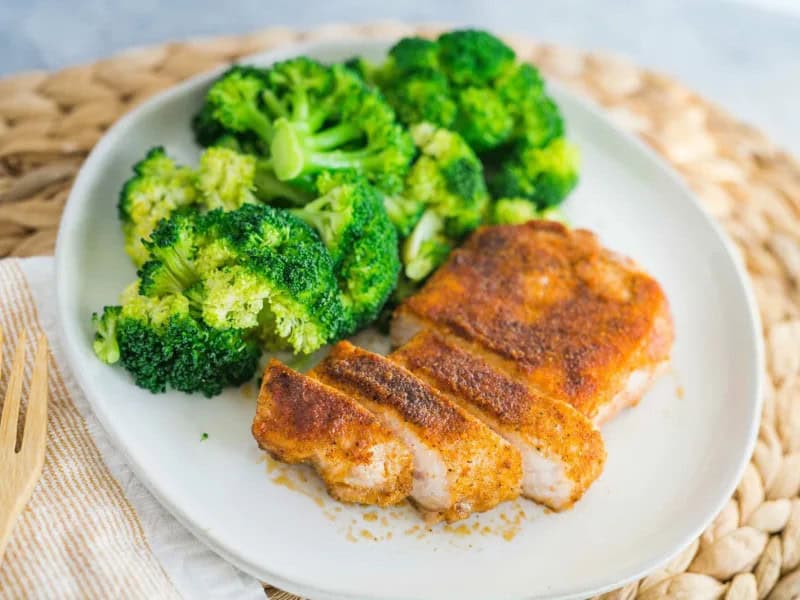 image 7688 - Juicy Baked Pork Chops prove that you don't need anything fancy to create a beautiful pork dinner. All you need is a herbaceous, garlic-y, smoky spice mixture and savory pork chops cooked to juicy and rosy perfection. In less than half an hour, you can have these chops on your plate, making them perfect for your weeknight rotation or hectic nights when you need a home-cooked pick-me-up. Juicy Baked Pork Chops are rustic, tender, and tasty, showing that simplicity doesn't mean skimping out on the sensational!