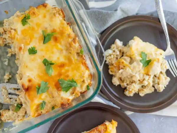 image 7819 - Just how Nana makes it, because she sure knows how to make something amazing. Nana's Tot Casserole layers on the flavors, starting with the melted cheese and the savory, creamy chicken mix. Beneath all that goodness is a fluffy bed of potato nuggets, ready to make things hearty, wholesome, and tasty! It's simple, rustic, and homespun; exactly how Nana likes her cooking. Nana's Tot Casserole is a legendary casserole that will become even more legendary once you try it for yourself!