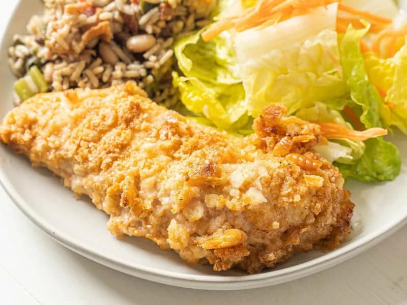 image 7820 - Congratulations! Whatever the occasion, it's time to get into the spirit with Celebration Chicken! This special chicken is coated and marinated in a tangy, creamy, and salty sauce designed to elevate the natural savoriness of the chicken. But it's the buttery, crispy cracker crust where the party truly lives; you can only imagine the firework-like crackle this chicken creates until you make it yourself. Celebration Chicken is perfect for hosting graduation, engagement, or promotion parties because it makes everyone's taste buds celebrate!