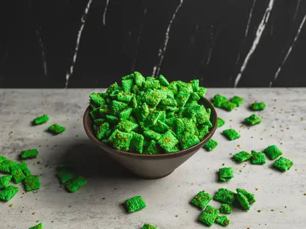 image 813 - If you need something that'll bring all the festive vibes, you're in luck! St. Paddy's Chow is coated in that vibrant shade of green that's responsible for good fortune! You'll be walking into the party pinch-free and covered in compliments because these icing-coated cereal treats taste just as fun as they look. You'll hit the jackpot with St. Paddy's Chow, no golden coins needed!