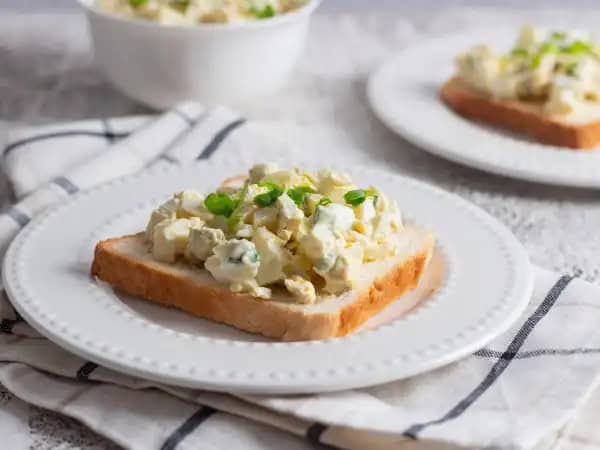 image 8563 - This is how you solve your egg salad cravings without breaking a sweat! Crack Egg Salad is the easiest way to get the good stuff on your plate, on a piece of bread, or on a buttery croissant: the amazing mixture of creamy, tangy, savory, eggy goodness with a touch of sweet and sour relish and crisp green onions! This Crack Egg Salad will have you cracking a smile in no time!