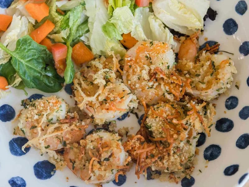 image 8645 - Garlic Parmesan Shrimp uses the classic shake-and-bake technique for this crunchy shrimp that’s a grown-up version of popcorn shrimp: buttery, garlicky, and with notes of sharpness from the cheese. It’s even a bit healthier since it’s not deep-fried. Garlic Parmesan Shrimp tastes divine alongside some lemon-butter pasta or with risotto. Within 30 minutes, you’ll have a delicious dish to compete with any high-end restaurant.