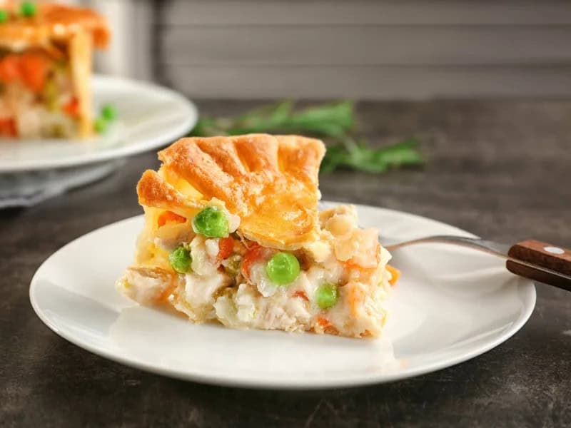image 8666 - Better than any roadside diner or English pub, this Classic Chicken Pot Pie is easy to make right at home with the help of pre-made pie crusts. All that’s left for you to do is prepare the creamy filling of chicken, cream peas, carrots, onion, and thyme. As you cut into the fully baked Classic Chicken Pot Pie, a heavenly smell will escape, a homemade cooking aroma that makes houses feel even more homey.
