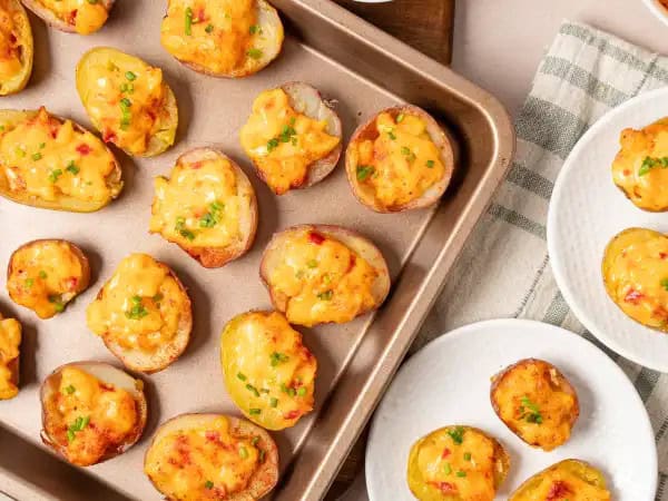 image 8817 - Tiny but mighty, these Halftime Show Bites run to the "I-need-a-good-snack" goal line like no other! Baby potatoes tackle your hunger when sacked full of a creamy pimiento cheese and almost-twice-baked potato-like filling when broiled to golden delight. Halftime Show Bites may become the full-time snack request at all your extra-curricular events. They're definitely a winner!