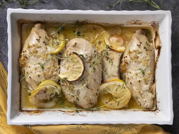 image 8818 - It shouldn't matter if you're busy or feeling lazy, you deserve a tasty dinner! This Oven-Baked Lemon Chicken is your ticket to an amazing meal either way. Get ready to chow down on some juicy, perfectly seasoned chicken breasts that are loaded with buttery, citrus flavors. You can serve it over a salad, pair it with your favorite sides, or even put it on a bun to create a phenomenal dish! Oven-Baked Lemon Chicken is the way to do it, no matter how your day is going!