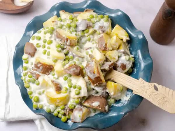 image 9227 - If you don't have a potluck on the calendar, well, you need to schedule one promptly so you can show off these Creamed Peas & Potatoes! A big bowl of these chunky potatoes and squishy peas, swimming in a creamy sauce is just what the spread of collaborating cuisines was missing. Come one, come all; it's time to chow down on some Creamed Peas & Potatoes!