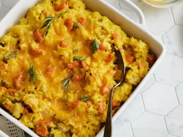 image 9436 - As Granny taught us, the secret to being a great home cook is always having a couple of great recipes readily available! That's why she always relied on Granny's Go-To Bake to make dinnertime great! This extra cheesy rice casserole is tender, creamy, and deliciously savory, filled with succulent chicken and garden-fresh veggies. You can taste the love baked right into it! Granny's Go-To Bake is guaranteed to become a go-to in your own kitchen, just as Granny intended!