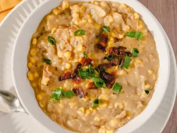 image 951 - When the breeze is brisk, the bowl needs to be warm. Let Creamy Corn Chowder warm you from the inside out! Packed full of golden new potatoes and sweet corn in each creamy spoonful, every bite is more comforting than the last. Add some crumbled bacon and sliced scallions, and this Creamy Corn Chowder will reach optimal soup perfection. Warm up to a bowl... even two!