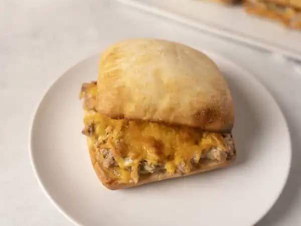 image 9701 - She's incredible, she's invincible, she's busy! Busy-Wife Melts are a lifesaving device to help the hecticness of mealtime melt away! When light tuna, chopped celery, cucumber, red onion, a little cheddar cheese, and a seasoned, creamy mayo come together broiled between ciabatta rolls, good things happen that make a wife very happy. In a pinch, Busy-Wife Melts help all the housewives and "househusbands" find a way to quickly help out when mealtime comes around! Did we mention she's incredible?!
