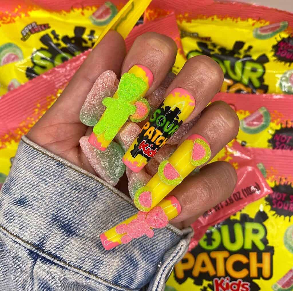 Detailed shot of festive nails showcasing candy cane stripes, lollipop swirls, and candy corn patterns in bright, vibrant hues.