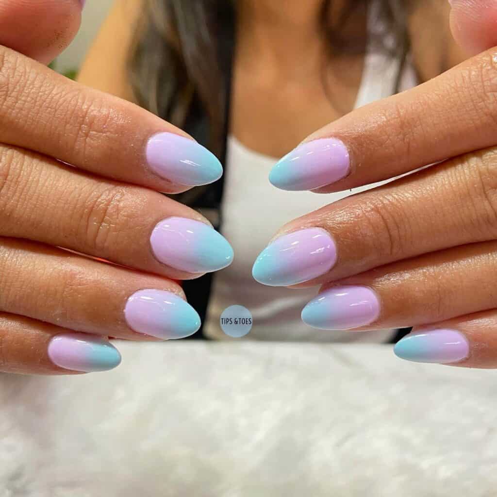 Detailed shot of festive nails showcasing candy cane stripes, lollipop swirls, and candy corn patterns in bright, vibrant hues.