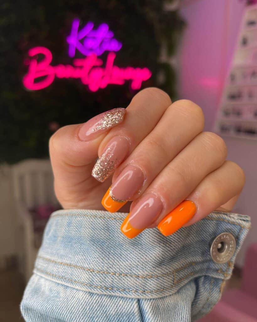 Chic summer nails featuring vibrant orange hues, from neon to burnt with glitter accents, perfect for adding a seasonal touch.