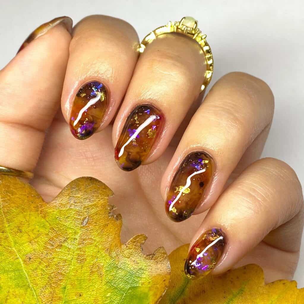 Discover the charm of amber nails with a variety of creative designs, from gel to acrylic styles. Find inspiration for your next manicure.