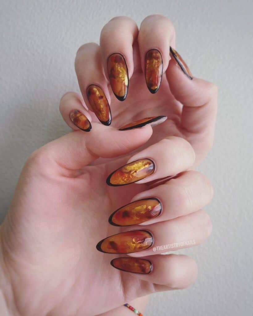 Discover the charm of amber nails with a variety of creative designs, from gel to acrylic styles. Find inspiration for your next manicure.