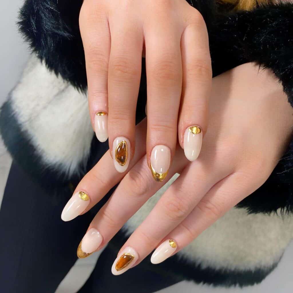 Discover the charm of amber nails with a variety of creative designs, from gel to acrylic styles. Find inspiration for your next manicure.