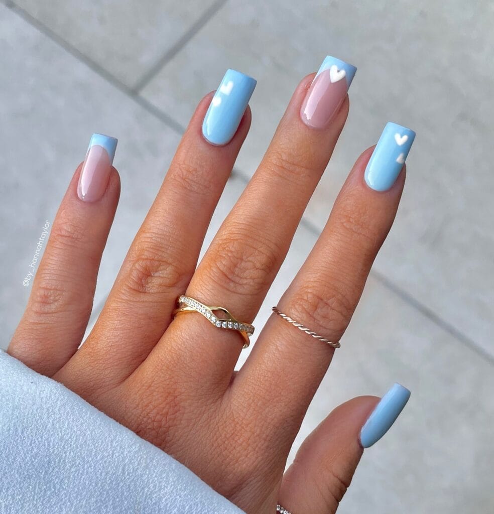 Varied blue nail designs showcasing light blue nails, royal blue acrylic nails, and blue French tips in different hand poses.