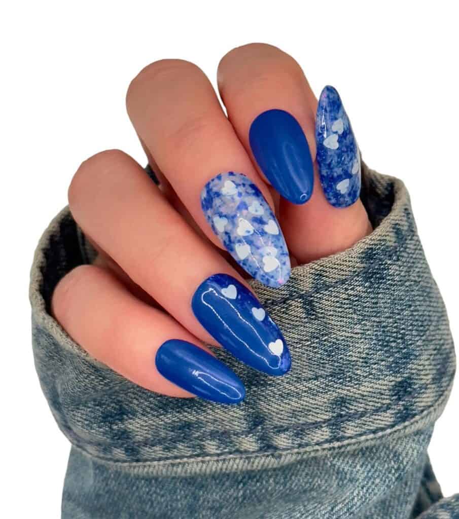 Varied blue nail designs showcasing light blue nails, royal blue acrylic nails, and blue French tips in different hand poses.