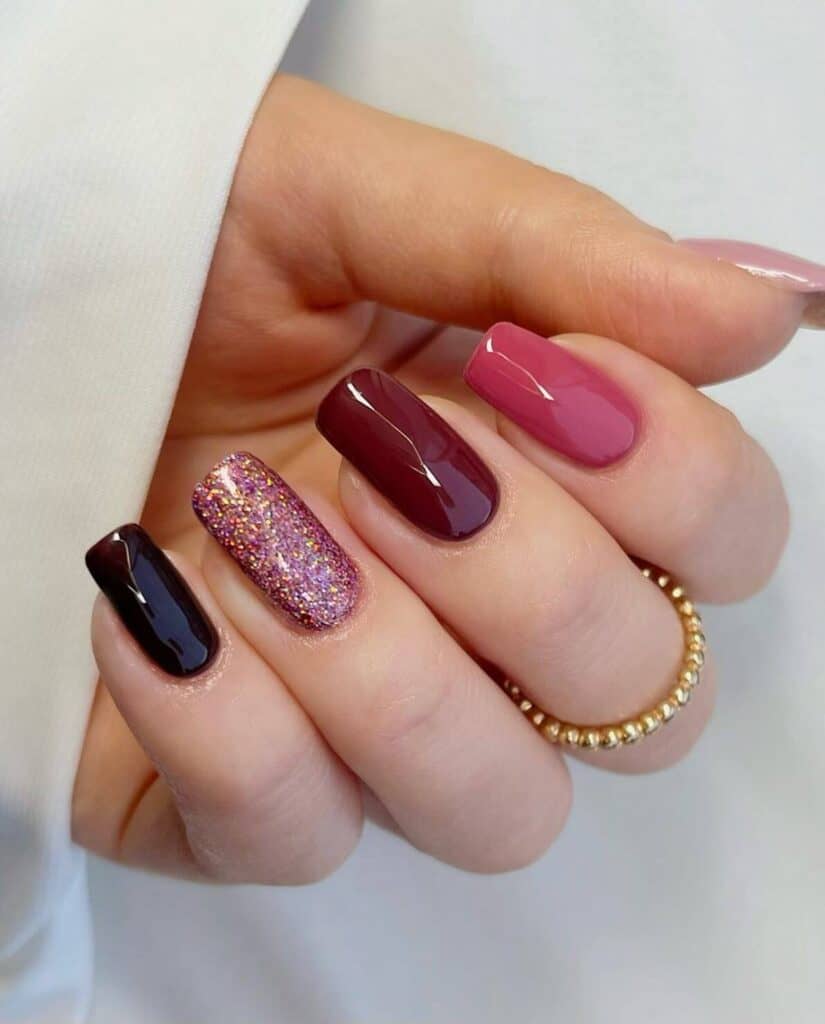 A selection of gradient nail styles such as autumn hues, black to red transitions, and blue glitter fades.