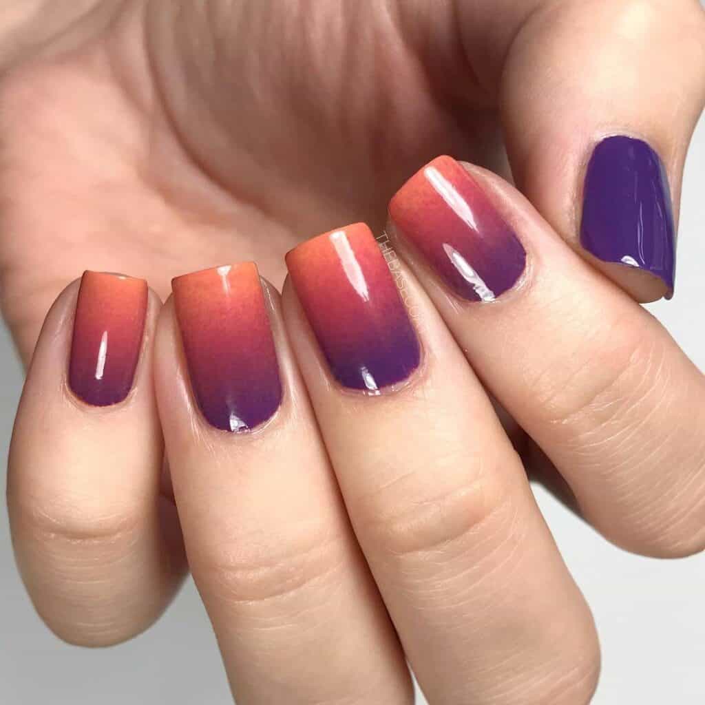 A selection of gradient nail styles such as autumn hues, black to red transitions, and blue glitter fades.