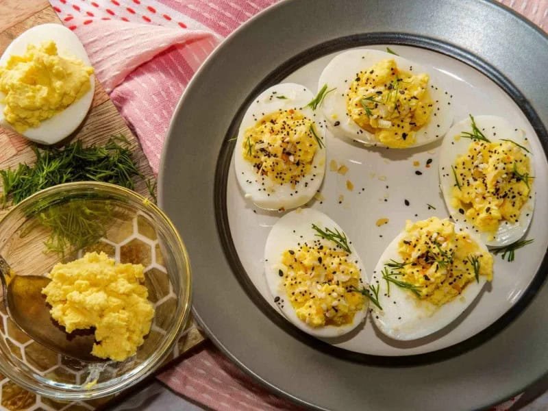 image 1284 - Everything Deviled Eggs are a great twist on a classic dish! The everything bagel seasoning makes this appetizer extra savory with a distinct bouquet of breakfast flavors. These creamy, tangy deviled eggs are perfect for grab-and-go snacks or appetizers for a dinner party. Make Everything Deviled Eggs for your next gathering and everyone will be asking you for the recipe!