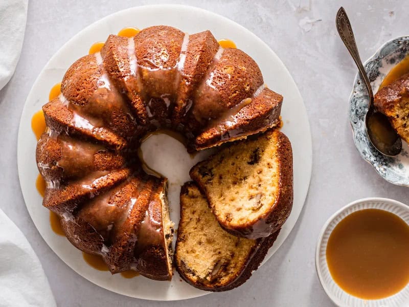 image 184 - Cha-ching! You're about to make a fortune for your tastebuds! Million Dollar Pound Cake has the classic buttery, tender, golden cake but now glazed with a rich and sticky caramel and filled with crunchy pecans and sugary toffee; every addition only adds to the butter-flavored goodness of each slice. Million Dollar Pound Cake is the kind of luxury you can whip up whenever you need to feel like a million bucks. It'll make everyone who tastes it feel like they won the flavor lottery!