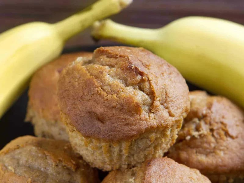 image 247 170 - These Quick Banana Muffins are melt-in-your-mouth soft and buttery! They have the perfect amount of cinnamon spice for a touch of warmth. They’re even naturally sweet from the ripe bananas. Quick Banana Muffins can be made in 30 minutes or less, so you can have breakfast ready in a hurry. Best of all, these muffins are totally customizable! Add pecans, walnuts, or chocolate chips for extra deliciousness, if you like!