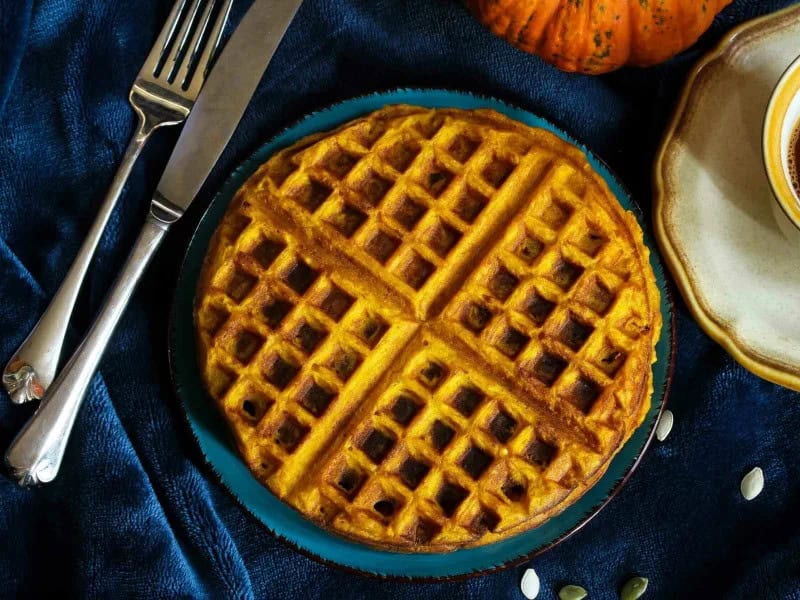 image 247 174 - Pumpkin Spice Waffles are the ideal breakfast recipe for the ultimate fall vibes! Perfectly spiced with cinnamon, ginger, and nutmeg, and infused with delicious pumpkin flavors, eating these waffles is like taking a bite of autumn. This decadent treat is crispy on the outside and fluffy on the inside. Pumpkin Spice Waffles are about to become your go-to breakfast for cozy fall mornings!