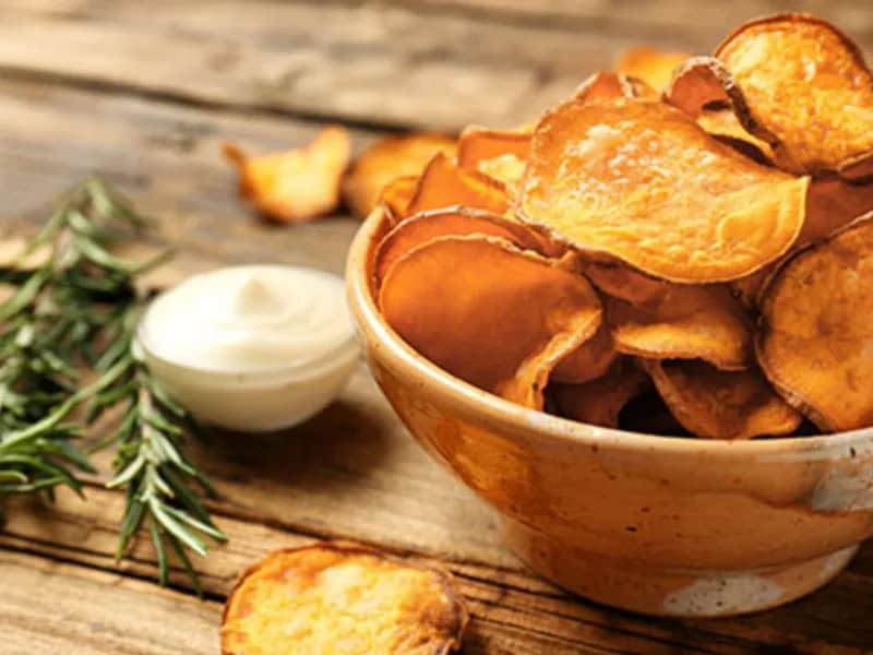 image 247 198 - Swap the greasy potato chips for these far-more-flavorful homemade Sweet Potato Chips. These bad boys are so delicious you'll forget they're actually healthy. They’re perfectly crispy and flavorful, seasoned with olive oil, salt, pepper, and dried thyme. Serve these Sweet Potato Chips as a snack or side to your favorite sandwich or main dish. Once you start eating these, you won’t be able to get enough!