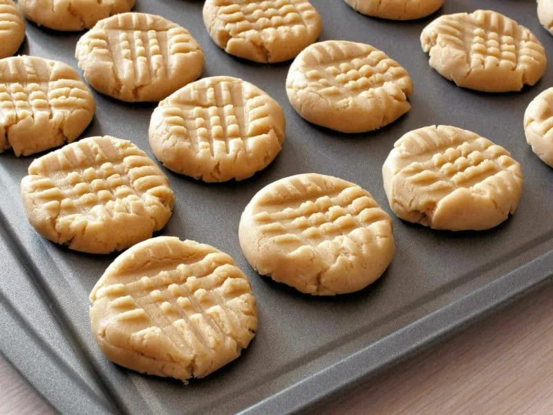 image 247 207 - You are in for a treat today! Why? Because you probably already have all of the ingredients you need to make these 3-Ingredient Peanut Butter Cookies. This recipe is quick, easy, and perfect for whenever you want to satisfy your sweet tooth but are short on time and ingredients. Each bite is filled with peanut-buttery goodness and is blissfully sweet. Make Peanut Butter Cookies and skip the store-bought cookie mix!