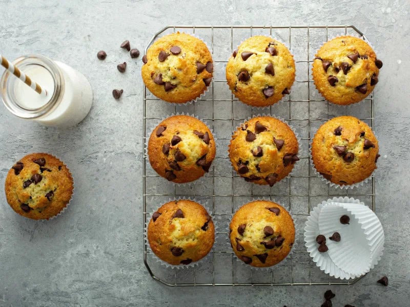 image 247 213 - Sometimes you wake up with a sweet tooth that you just need to satisfy. Not to worry: Chocolate Chip Muffins have the perfect amount of chocolate and sugar to kickstart your day and settle your craving. They’re chewy, fluffy, and sweet — you’ll start your morning on the right foot! Chocolate Chip Muffins serve up all the bakery-level goodness you want from morning muffins! Each bite is indulgent, chocolatey, and absolutely scrumptious.