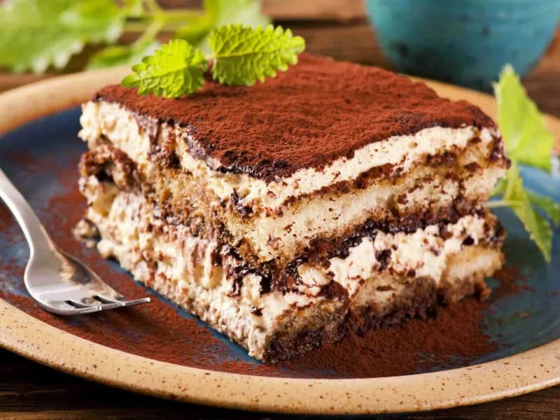 image 247 216 - You don't need to go to an Italian restaurant for some amazing Tiramisu! This dessert, which translates literally to "pick-me-up," is made of coffee-soaked ladyfingers layered in a creamy and rich mixture of sugar, mascarpone, and cocoa. The sweetness is perfectly balanced out by the strong espresso flavor, and it makes for a truly amazing dessert. Tiramisu can satisfy your sweet tooth with aplomb!