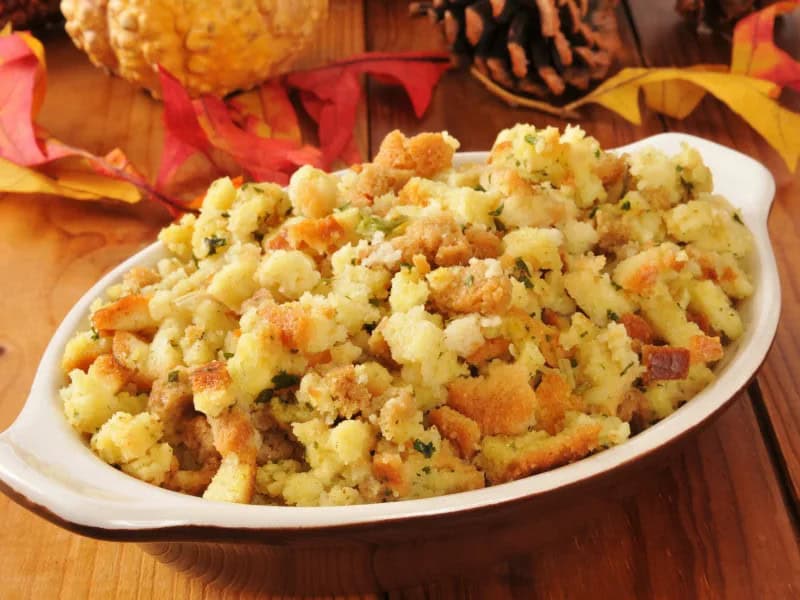 image 247 348 - Thanksgiving recipes are passed down for generations, and for good reason: they're too tasty to forget! Mom's Cornbread Dressing combines two of the best Thanksgiving sides—sweet, hearty cornbread and earthy, moist dressing—and transforms it into a singular showcase side! Saturated with savory chicken flavors and Thanksgiving sage, it's a tender accompaniment that brings out the meaty flavors of your main course. Shhh—don't tell mom that we're sharing her recipe!