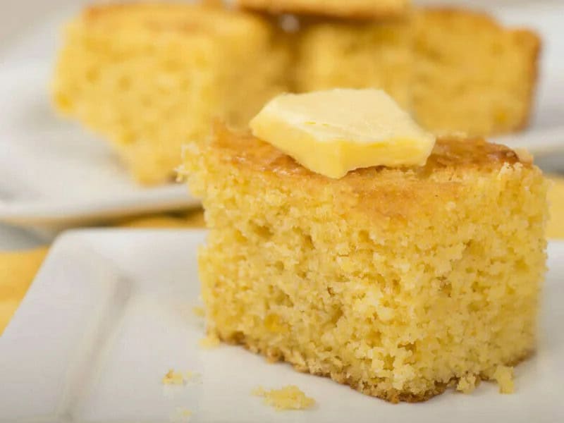 image 247 355 - Cornbread is the perfect addition to any meal, whether it’s breakfast, lunch, or dinner! Sweet Buttermilk Cornbread is a moist and fluffy cornbread that is quick to make and complements any main dish. Just be careful—once you set this dish down it'll disappear in seconds! Sweet Buttermilk Cornbread is irresistibly indulgent and flavorful; you’ll want to make it over and over again.