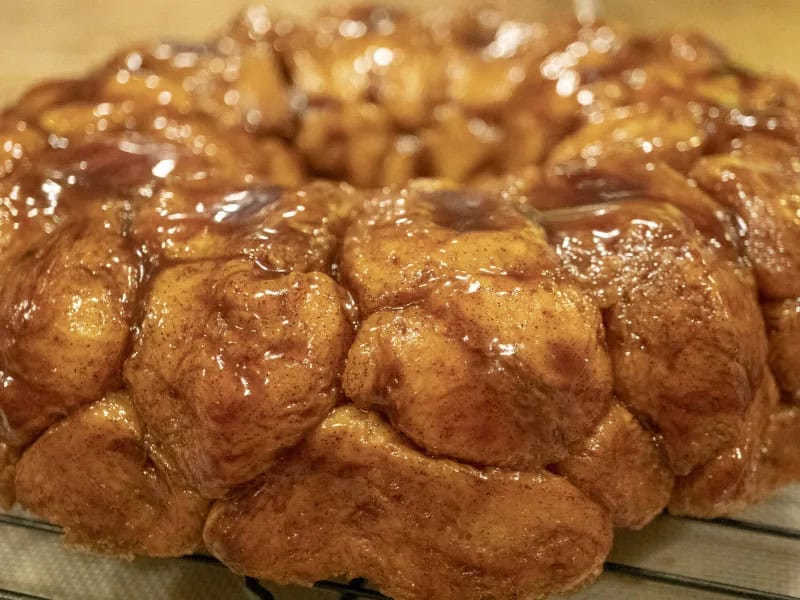 image 247 435 - Classic Monkey Bread is a traditional holiday confection, but you can make it any time of the year for some much-needed sweetness! This treat contains cinnamon, sugar, and fluffy biscuit dough. Serve this Classic Monkey Bread warm and top it with some rich vanilla bean ice cream for the dessert of your dreams!