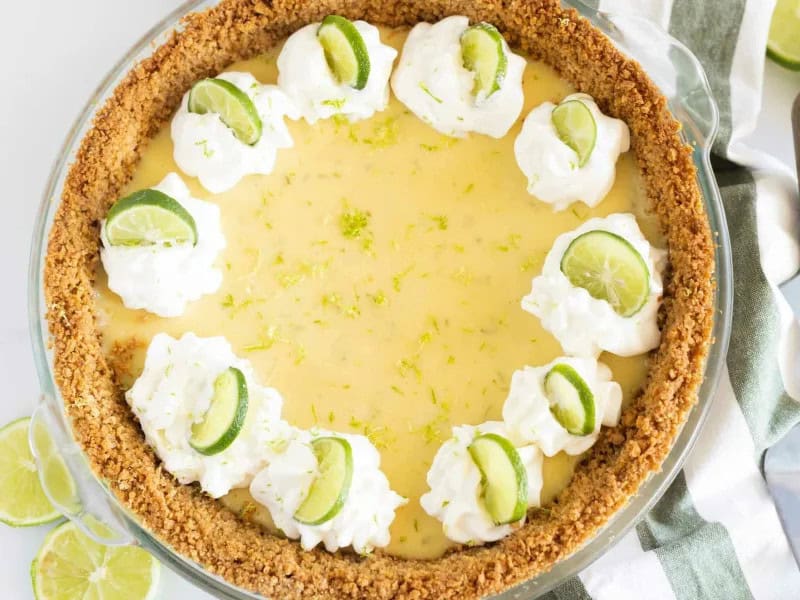 image 247 497 - The key to a Key West Key Lime Pie is the lime. Key limes are sweeter and less acidic, providing the perfect balance of flavor for the sweet and creamy filling. But of course, Key West Key Lime Pie isn't all about the lime; it's also about the buttery, crumbly graham cracker crust and the fluffy, refreshing, and homemade whipped cream dolloped onto each slice. Think of Key West Key Lime Pie like a trip to the beach: you need the sun, sure, but you also need the cool surf and the white sands beneath your feet. With just a bite, your taste buds are going on a beach trip!