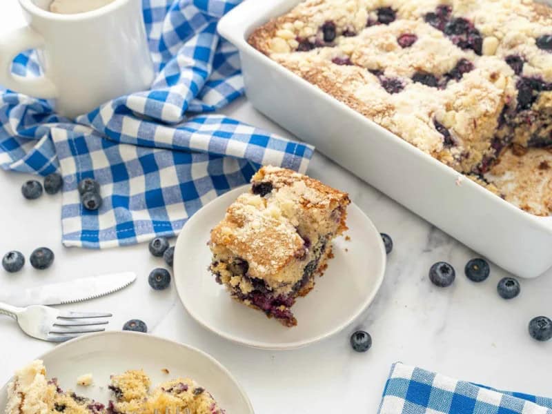 image 673 - Blueberry Pancake Casserole essentially combines pancakes and coffee cake to make a breakfast treat unlike any other. The texture is fluffy, like the best pancakes fresh off the griddle, with an added buttery crunch from the sweet cinnamon streusel. Light, airy, sweet, and filled with the tart fruitiness of blueberries, Blueberry Pancake Casserole is like a short stack in every slice. This is a breakfast indulgence that you'll be craving constantly!