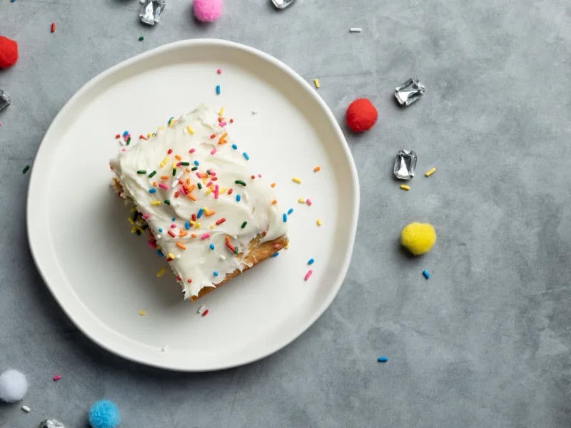 image 93 - "Celebrate good times, come on!" Whether it's a birthday, a promotion, retirement, or you're just happy to be with your people, Celebration Cake brings sweet vibes and fun times! Slide your fork into this moist, sugary vanilla cake to let the good times roll! Each bite has a pop of confetti, within the cake and atop the creamy, rich vanilla icing. How can you not take part in the festivities when Celebration Cake is the life of the party?! Bring your good times and your laughter, too, you're in for quite the treat!