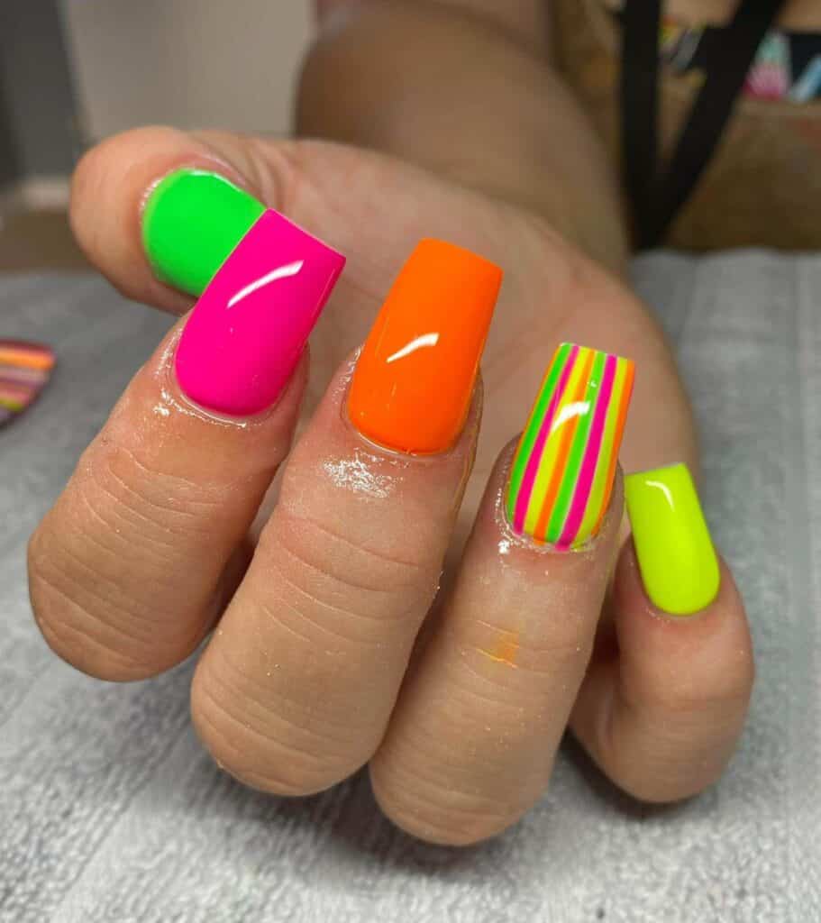 Radiant and lively neon nails featuring fashionable summer designs.