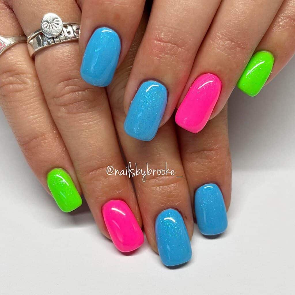 Radiant and lively neon nails featuring fashionable summer designs.