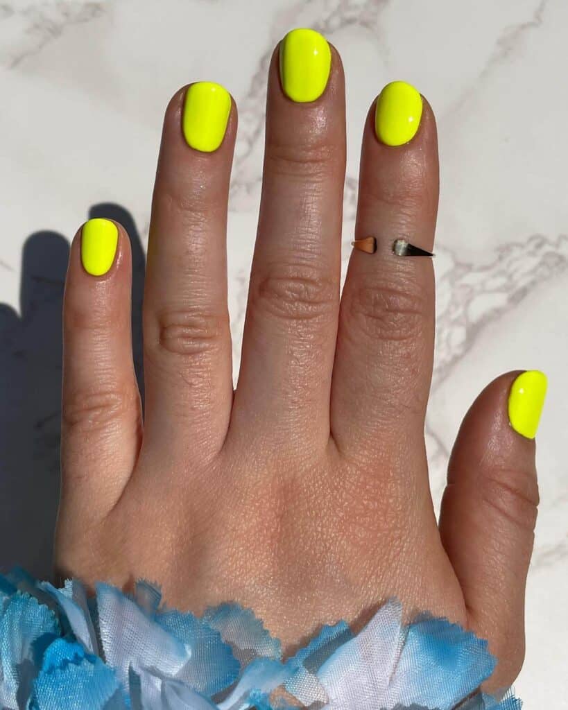 Radiant and lively neon nails featuring fashionable summer designs.