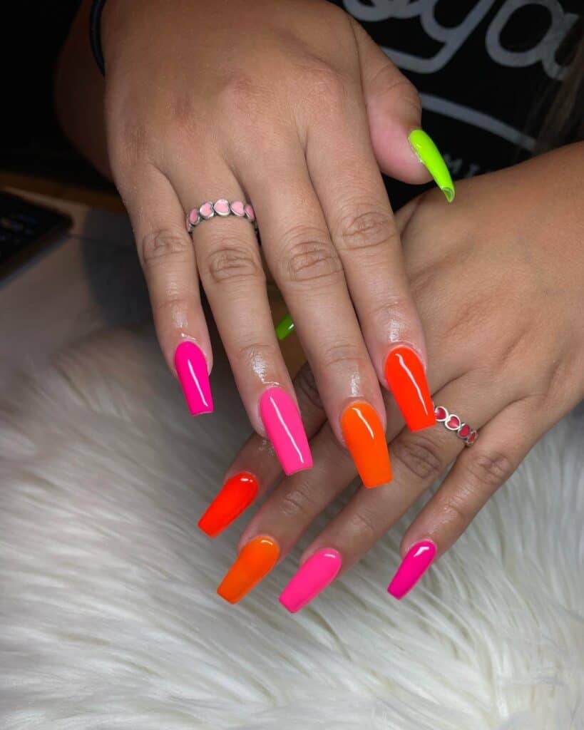 Radiant and lively neon nails featuring fashionable summer designs.